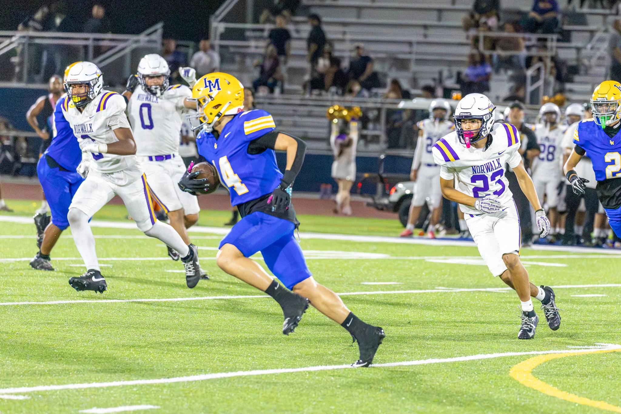 Running down field with the ball for La Mirada