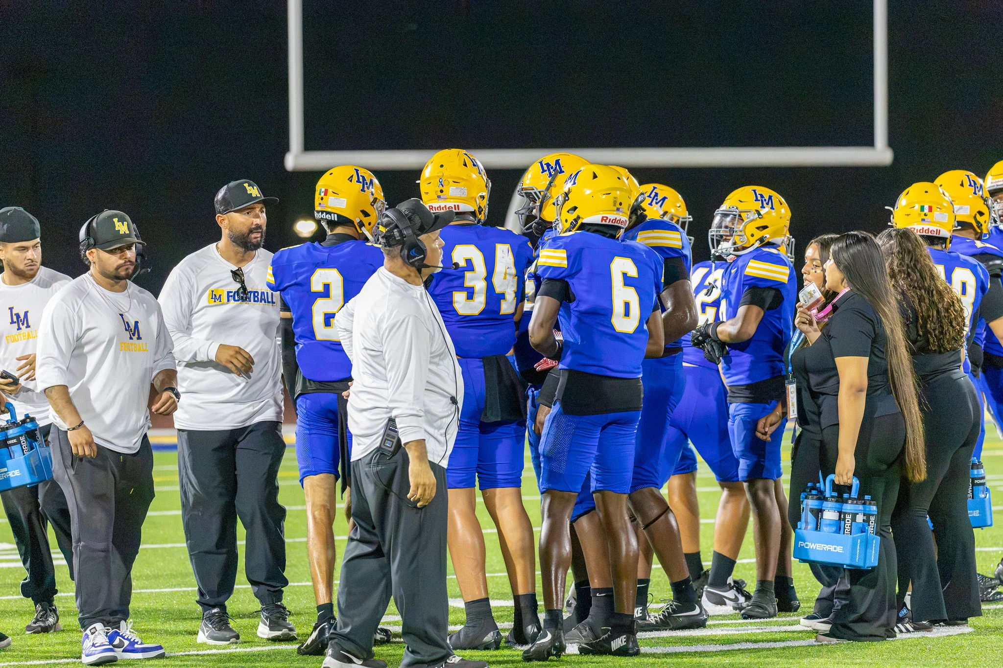 La Mirada huddle along the sidelines